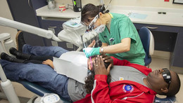 Child receiving dental treatment