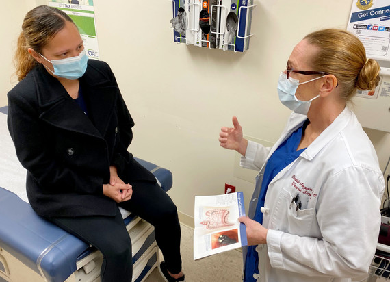 Patient consults with doctor in office