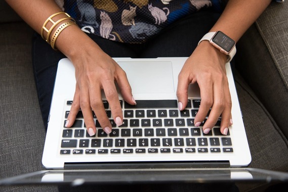 Closeup of hands on a keyboard