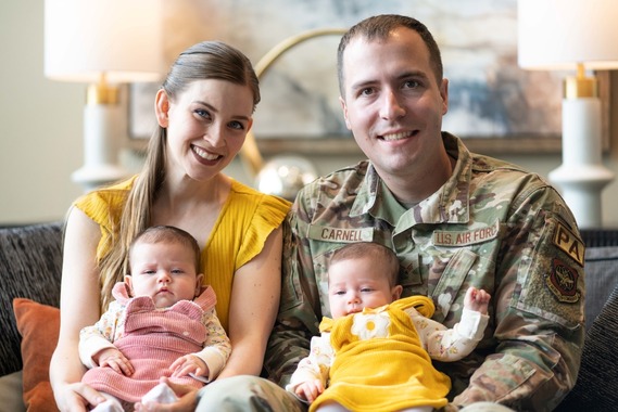 Airman, his wife, and their twin infant daughters