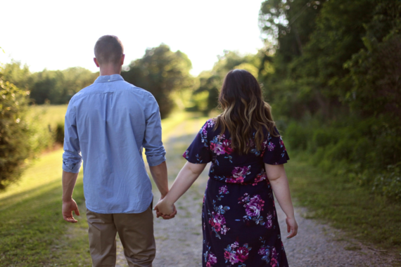 Couple holds hands