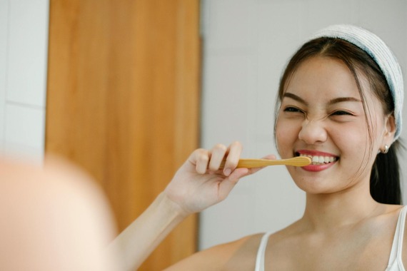 Woman brushing teeth