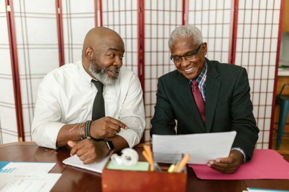 Two older men in business attire