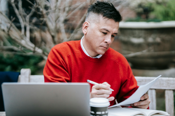 Man works on laptop