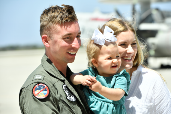 Young family smiles together 