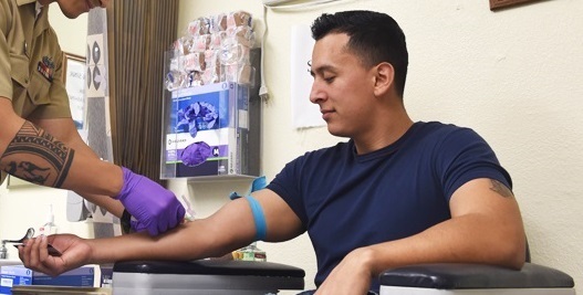 Man getting blood drawn for HIV test.
