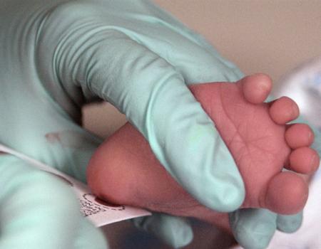 Blood from an infant's heel is taken for newborn screening. Credit: U.S. Air Force