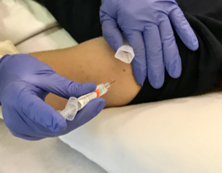 volunteer in trial of BPL-1357 universal flu vaccine candidate receives intramuscular injection