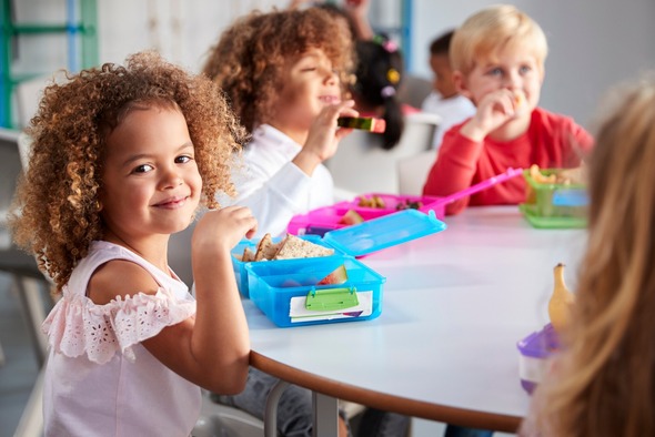 Young children eating lunch at school