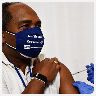 NIDDK Director Dr. Griffin P. Rodgers receiving COVID-19 vaccination at the NIH Clinical Center