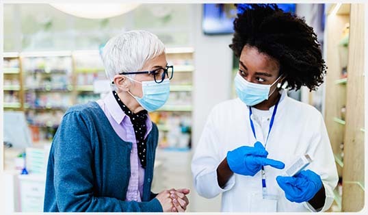 A health care professional speaking with a patient.