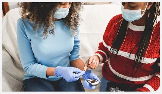 A nurse taking a blood sample. 