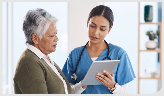 A health care professional speaking with a patient.