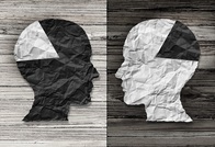 image representation of research spotlight article on predicting and quantifying stereotypes, depicted as two human heads with black and white sections looking at each other
