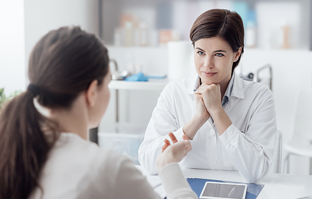 A patient discussing questions and concerns with her doctor.