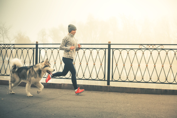 Woman jogging with dog
