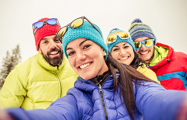 A group of active friends taking a selfie for the #OurHearts movement.