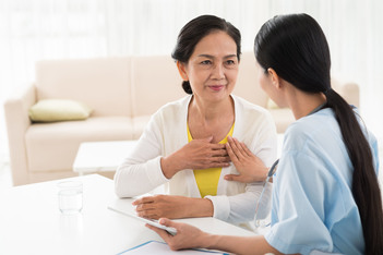 Older woman and doctor discussing heart diseases