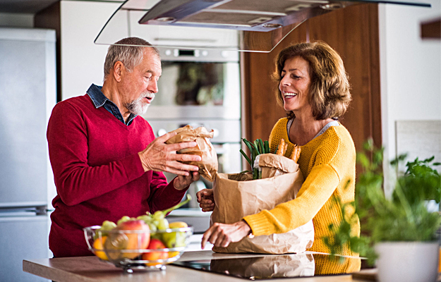 A senior couple preparing healthy food.