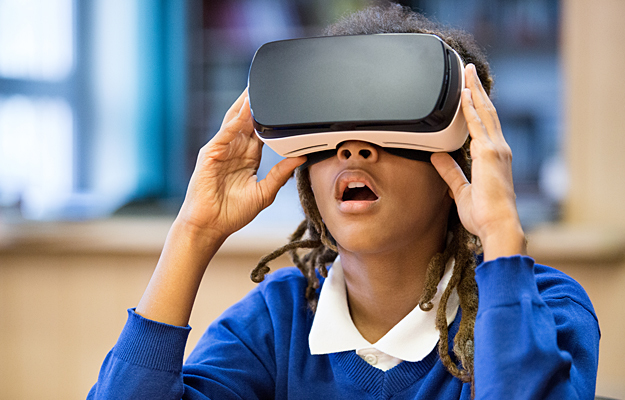 A young girl wearing a virtual reality headset.