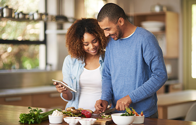 A couple cooking a heart-healthy meal together.