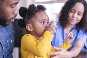 Girl using an inhaler