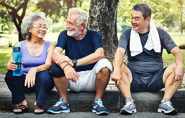 Three seniors resting after exercising.