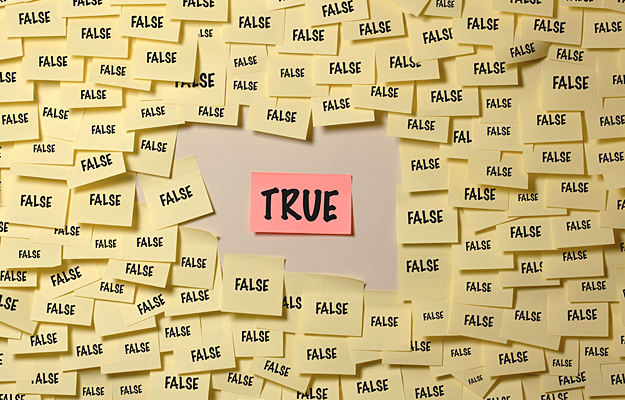 A Post-it that says "True" surrounded by several Post-its that say "False".