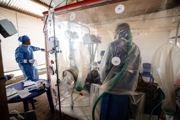 Health workers caring for a patient suspected of having Ebola