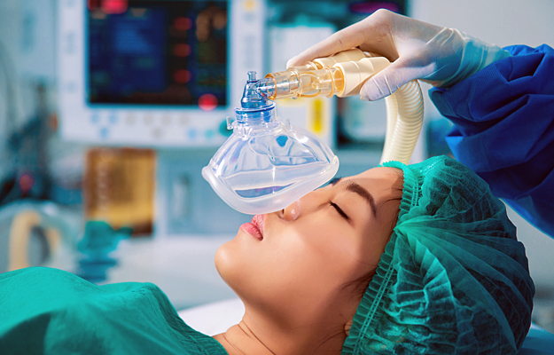 A woman undergoing anesthesia.
