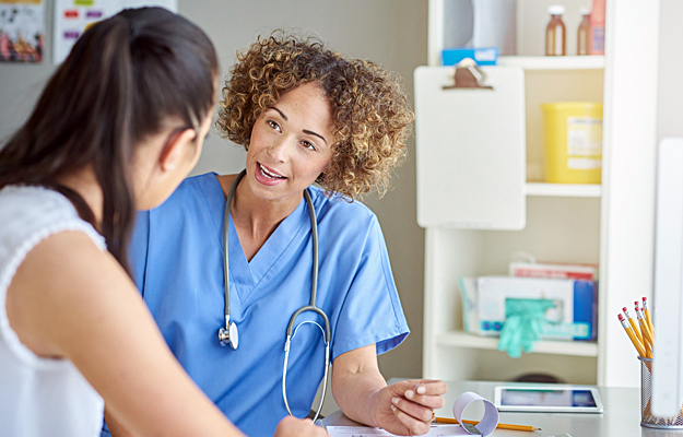 A woman speaking with her doctor.