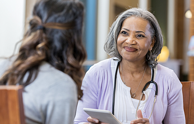 A woman speaking with her doctor.