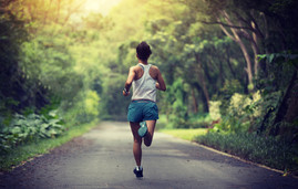 Woman running on a park trail