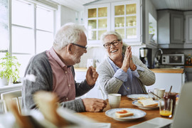 Couple finishing breakfast