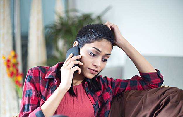 A woman talking on her phone.