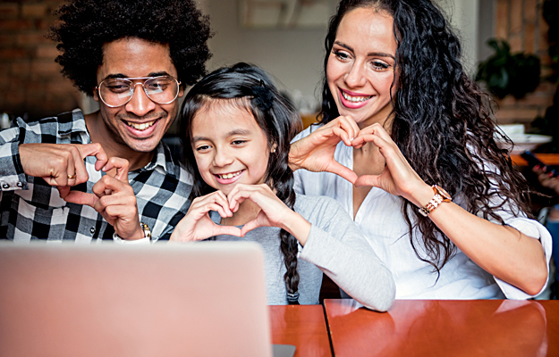 A family of three on a video call.