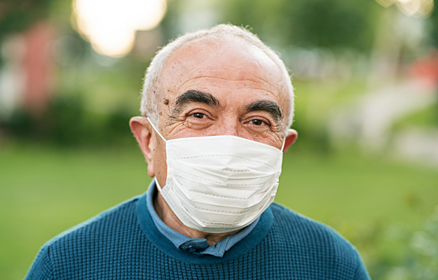 A senior man wearing a face mask.