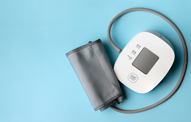 A blood pressure monitor on a blue background.