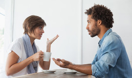 Couple talking in coffee shop