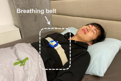 Graduate student sleeps with a breathing belt