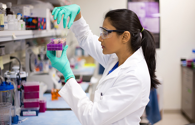 A female researcher working in a lab.