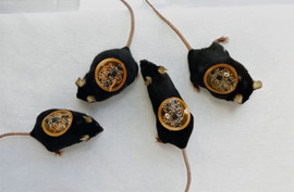 Four mice with flexible, circuit-covered bandages on their backs