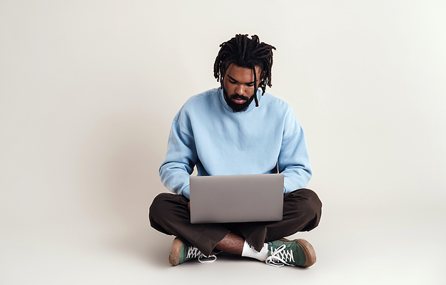 A man looking at a laptop.