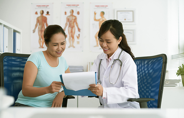 A patient and doctor reviewing information.