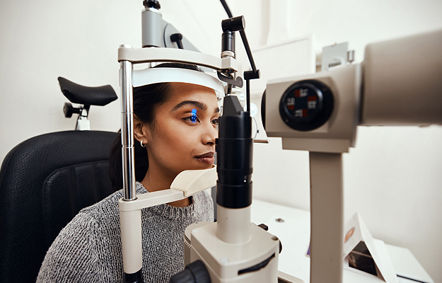 A woman getting an eye exam.