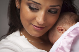 Woman holding newborn.