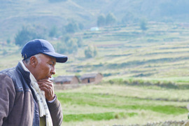 Pensive older Native American man in the countryside.