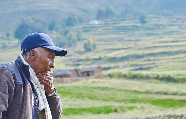 A pensive older Native American man in the countryside. 