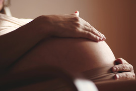 Close-up belly of a pregnant woman.