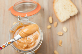 A small amount of peanut butter on a knife.